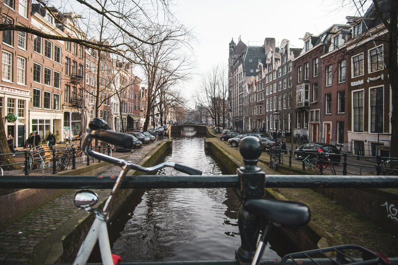 enablegreen-esg-jobs-amsterdam-the-netherlands-canal-landmark